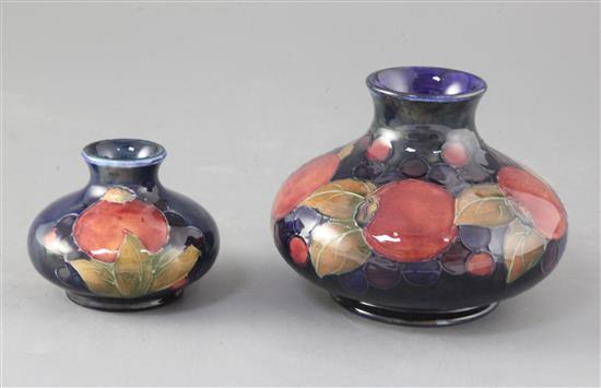 Two Moorcroft pomegranate pattern squat baluster vases, height 10cm and 7cm
